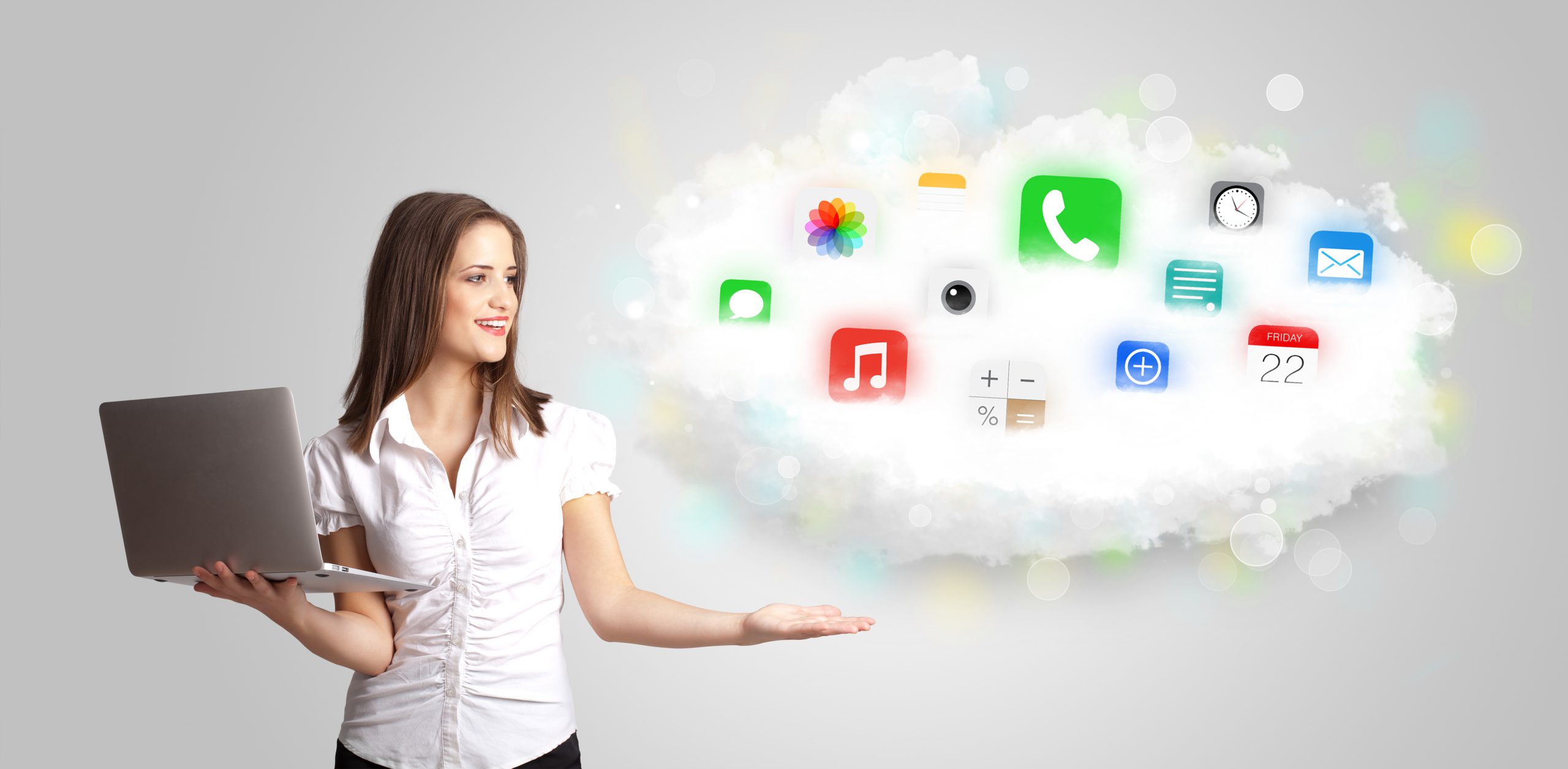 Young woman presenting cloud with colorful app icons and symbols concept