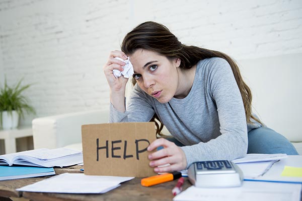 young woman asking for help suffering stress doing domestic acco