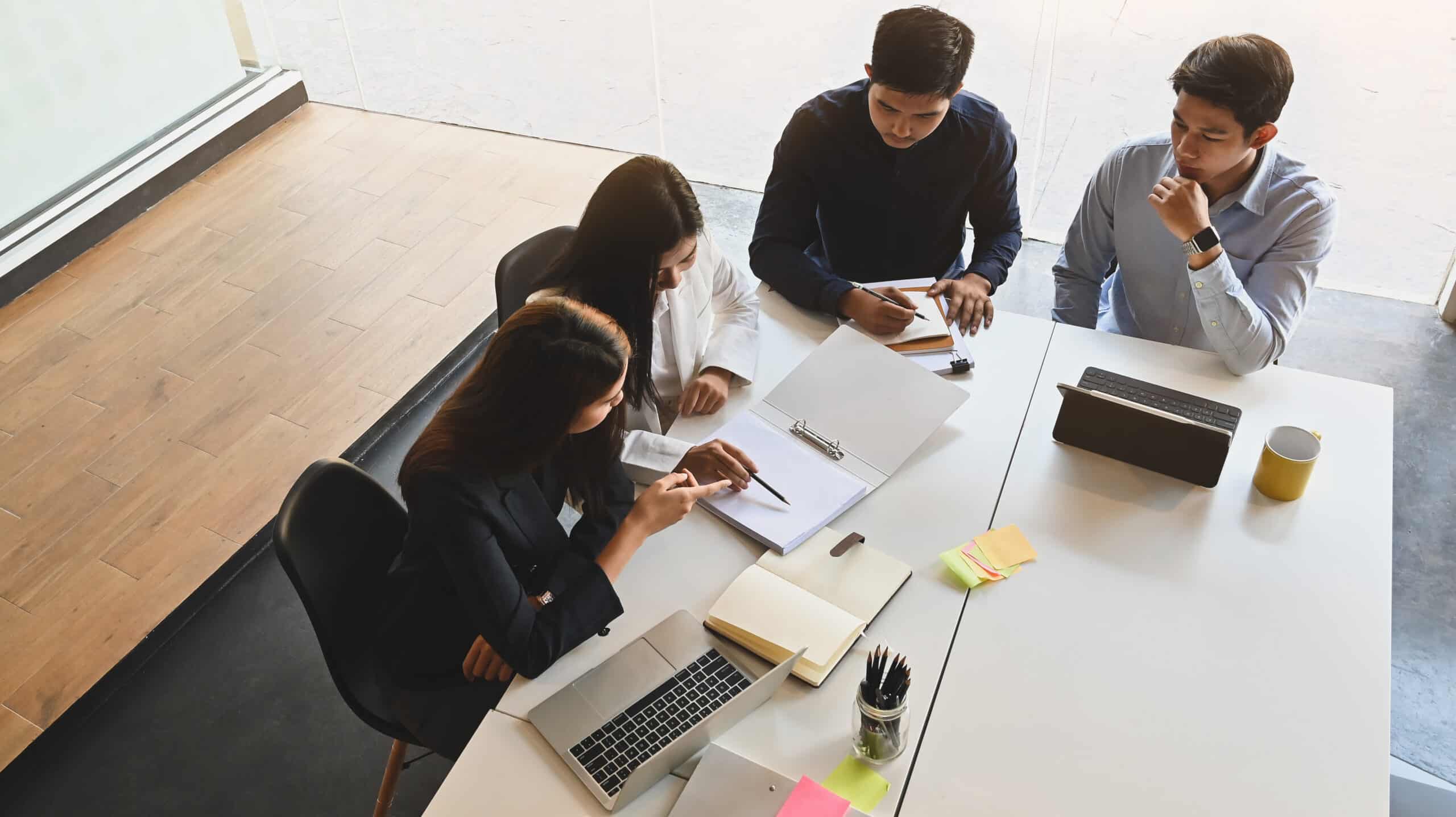 Photo of young business meeting/brainstorming with startup concept in meeting room at the modern office. Meeting/brainstorming concept.